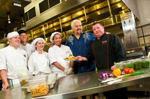 Food Network Chef Guy Fieri pays a visit to UNLV's culinary department while shooting for his show "Diners, Drive-ins and Dives" on Thursday, Jan. 26, 2012. Fieri, a UNLV alumnus, caught up with instructor Vincent Eade, who was Fieri's faculty adviser, and taught students some tricks of the trade.